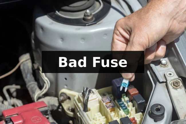 mechanic changing bad fuse