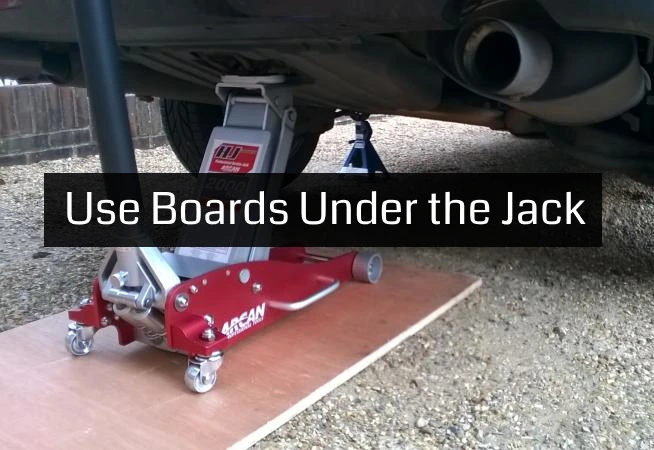 plywood board under the jack when lifting car
